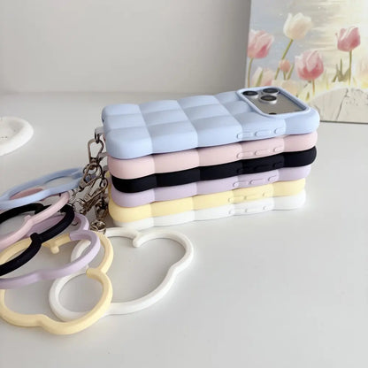 Pastel puffer silicone phone cases for iPhone 18 Pro Max stacked back view with cloud wrist ring accessories