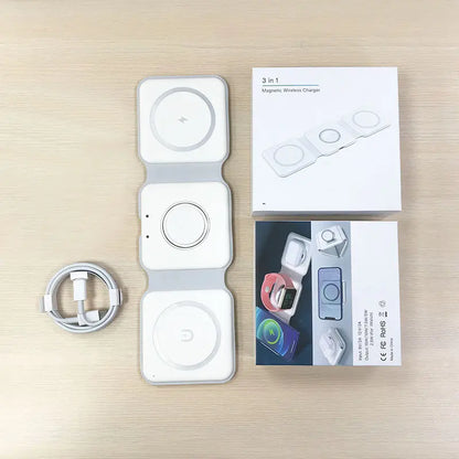 Complete set of fold‑able three‑in‑one wireless charger, USB‑C cord and original packing box laid on wooden desktop