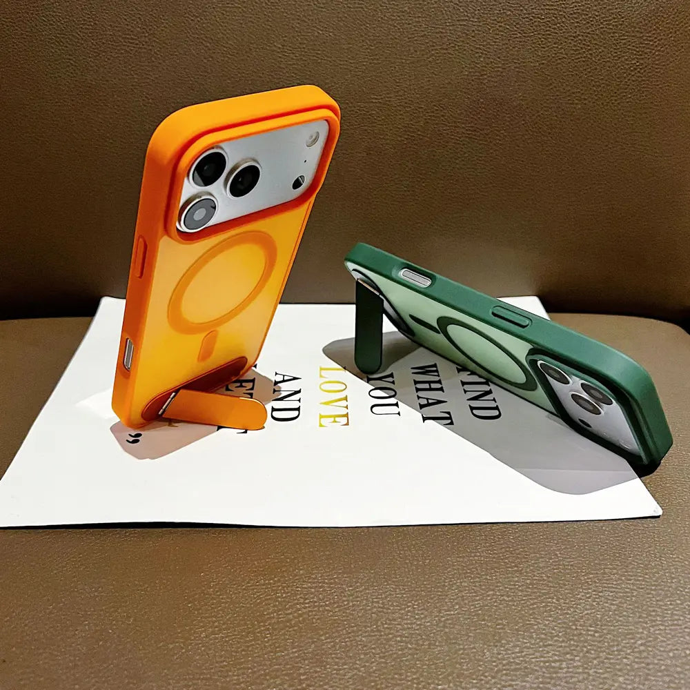 Orange and green cellphone case propped‑up by built‑in metal stand